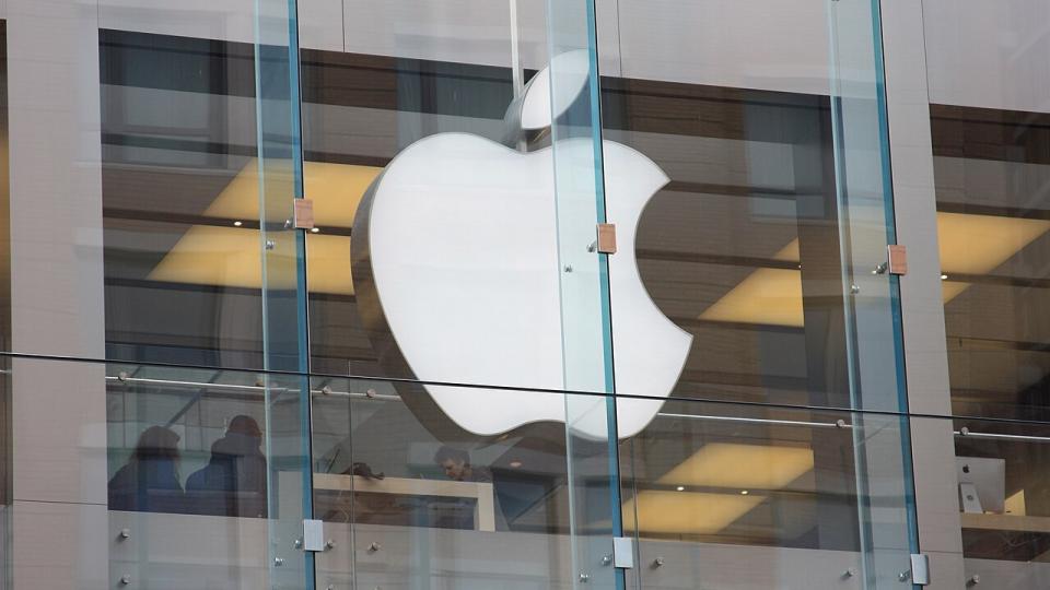 Apple logo on the glass front of an Apple Store